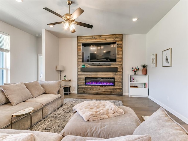 222 Alamosa Rd, Norman, OK 73069 - living room with wood finished floors, a large fireplace, a ceiling fan, baseboards, and recessed lighting