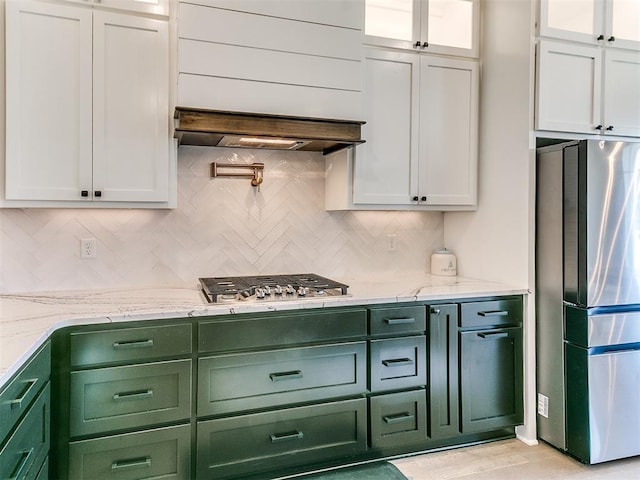 222 Alamosa Rd, Norman, OK 73069 - kitchen with green cabinetry, appliances with stainless steel finishes, decorative backsplash, and white cabinetry