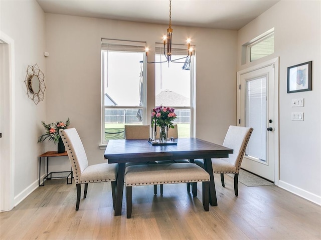 222 Alamosa Rd, Norman, OK 73069 - dining area featuring a chandelier, light wood-style floors, and baseboards