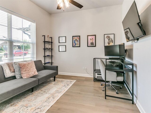 222 Alamosa Rd, Norman, OK 73069 - home office featuring a ceiling fan, light wood-style floors, and baseboards