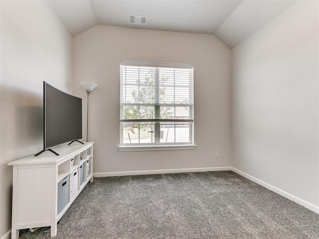 222 Alamosa Rd, Norman, OK 73069 - unfurnished living room with vaulted ceiling, plenty of natural light, carpet, and baseboards