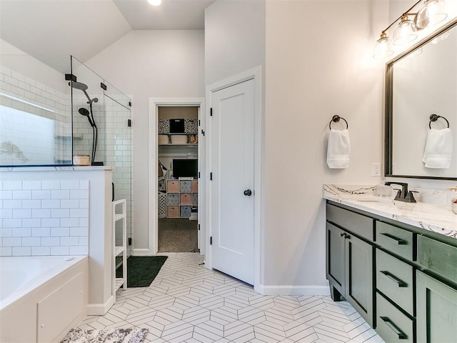222 Alamosa Rd, Norman, OK 73069 - full bathroom with a shower stall, vaulted ceiling, a bath, vanity, and a spacious closet