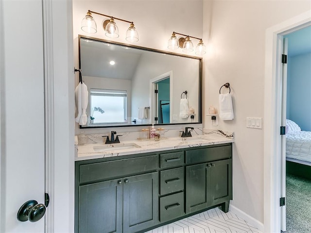 222 Alamosa Rd, Norman, OK 73069 - bathroom with double vanity, ensuite bathroom, and baseboards