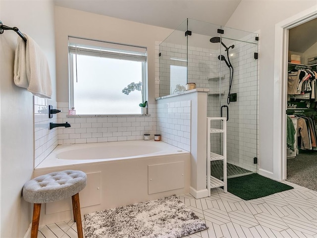 222 Alamosa Rd, Norman, OK 73069 - bathroom with tile patterned floors, a stall shower, a spacious closet, a garden tub, and baseboards