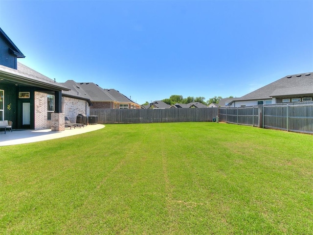 222 Alamosa Rd, Norman, OK 73069 - view of yard with a patio, central air condition unit, and a residential view