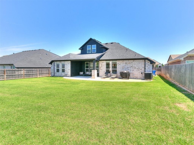 222 Alamosa Rd, Norman, OK 73069 - rear view of house with a patio area, brick siding, central AC, and a shingled roof