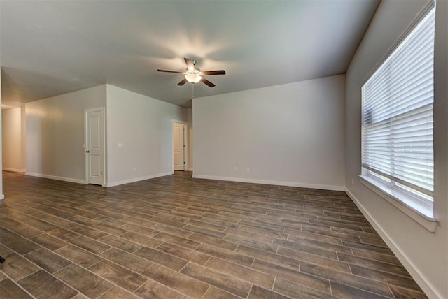 9749 Livingston Rd, Edmond, OK 73025 - empty room featuring ceiling fan, dark wood-style floors, and baseboards