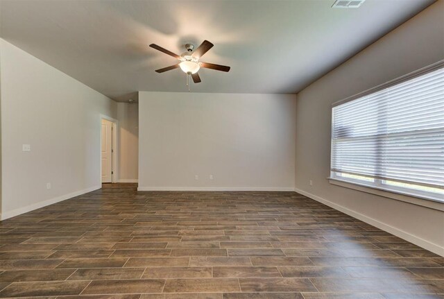 9749 Livingston Rd, Edmond, OK 73025 - spare room featuring a ceiling fan, dark wood finished floors, and baseboards
