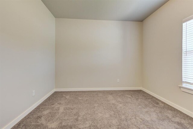 9749 Livingston Rd, Edmond, OK 73025 - empty room featuring carpet flooring and baseboards