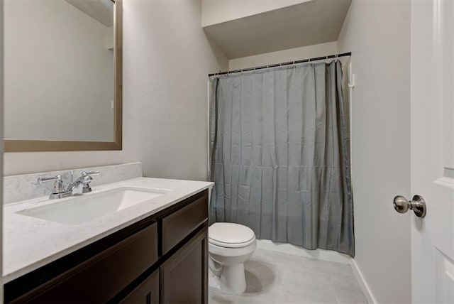 9749 Livingston Rd, Edmond, OK 73025 - bathroom with vanity, tile patterned floors, toilet, and baseboards