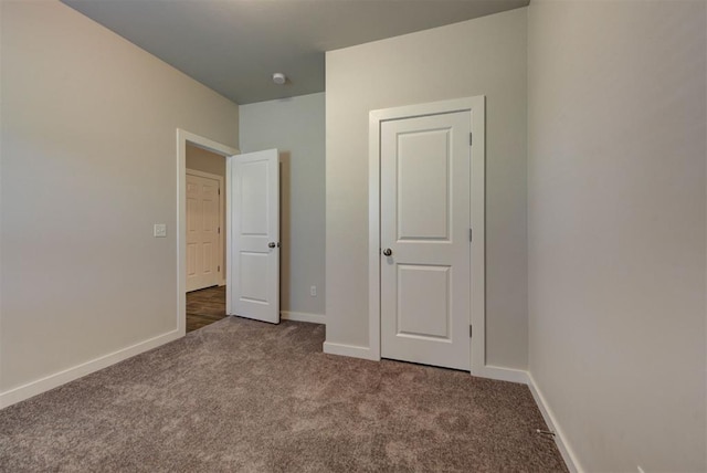 9749 Livingston Rd, Edmond, OK 73025 - unfurnished bedroom featuring carpet and baseboards