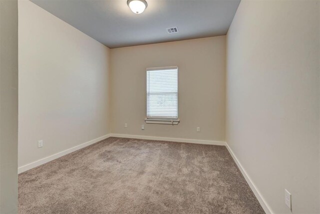 9749 Livingston Rd, Edmond, OK 73025 - carpeted spare room featuring baseboards
