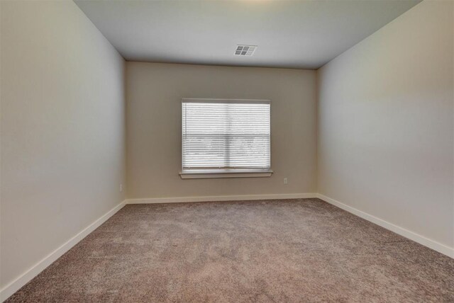 9749 Livingston Rd, Edmond, OK 73025 - empty room featuring carpet floors and baseboards