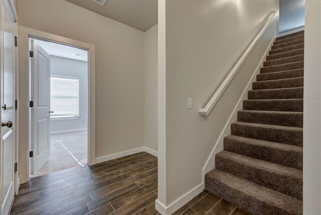 9749 Livingston Rd, Edmond, OK 73025 - stairway with wood finish floors and baseboards