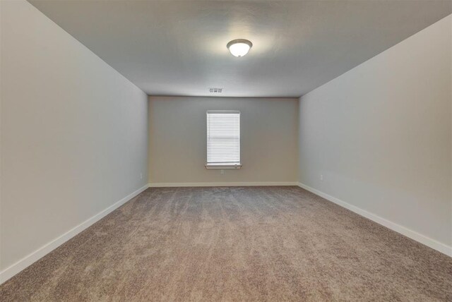 9749 Livingston Rd, Edmond, OK 73025 - unfurnished room with carpet and baseboards