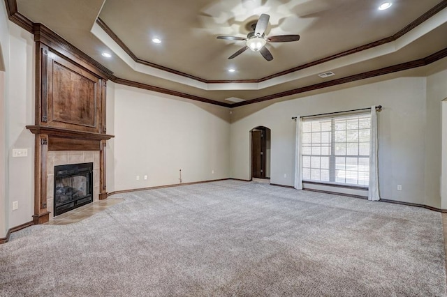 924 Regal Rd, Yukon, OK 73099 - unfurnished living room featuring crown molding, light colored carpet, a ceiling fan, a raised ceiling, and baseboards