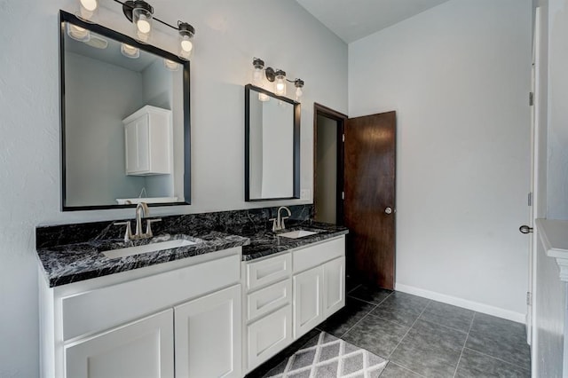 924 Regal Rd, Yukon, OK 73099 - full bathroom featuring tile patterned floors, double vanity, and baseboards