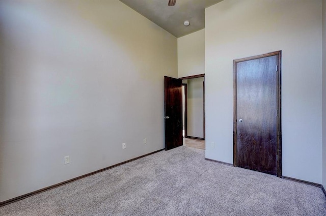 924 Regal Rd, Yukon, OK 73099 - unfurnished bedroom with carpet and baseboards