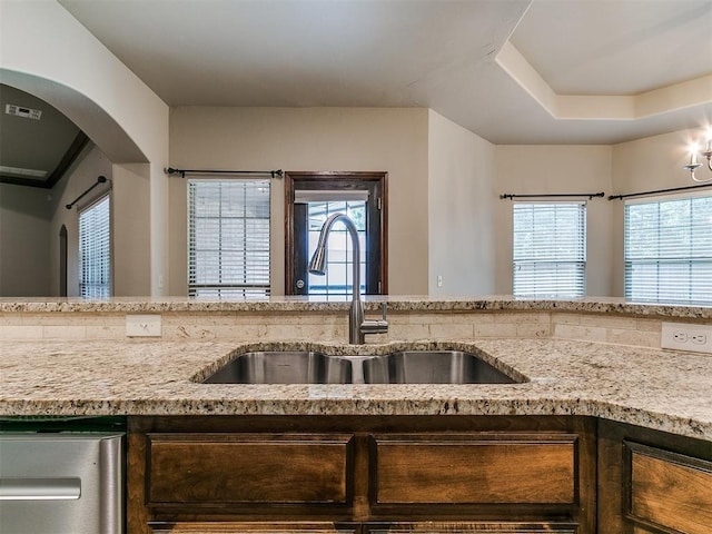 924 Regal Rd, Yukon, OK 73099 - kitchen featuring a sink, light stone countertops, and plenty of natural light