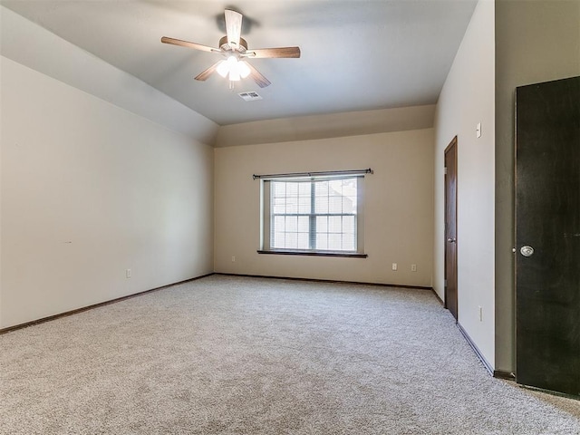 924 Regal Rd, Yukon, OK 73099 - empty room featuring carpet flooring, a ceiling fan, baseboards, and vaulted ceiling