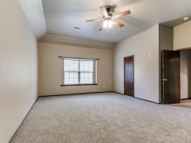 924 Regal Rd, Yukon, OK 73099 - unfurnished bedroom featuring carpet, vaulted ceiling, baseboards, and a ceiling fan