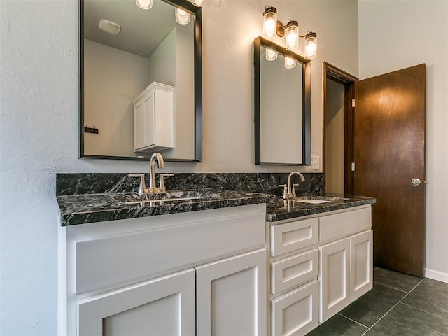 924 Regal Rd, Yukon, OK 73099 - full bath featuring double vanity, tile patterned floors, and a textured wall