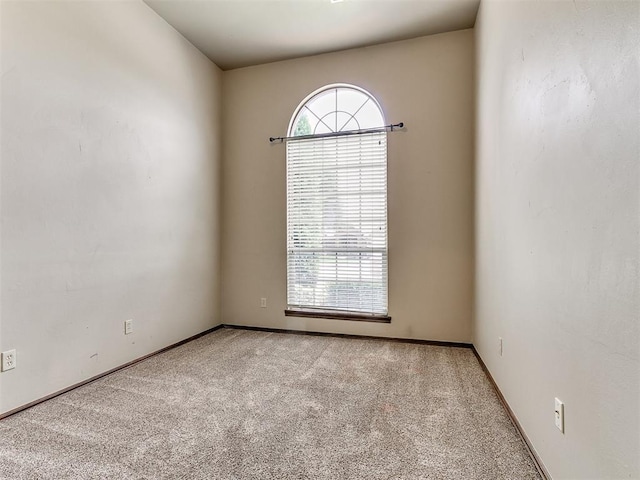 924 Regal Rd, Yukon, OK 73099 - spare room featuring carpet floors and baseboards