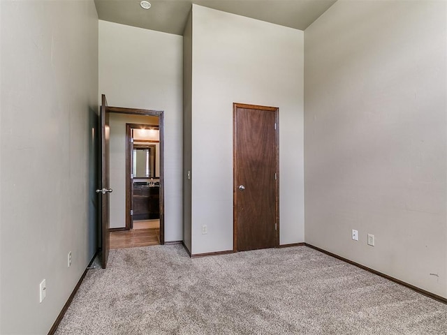 924 Regal Rd, Yukon, OK 73099 - unfurnished bedroom featuring carpet floors and baseboards