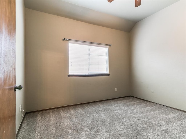 924 Regal Rd, Yukon, OK 73099 - carpeted empty room featuring a ceiling fan, vaulted ceiling, and baseboards