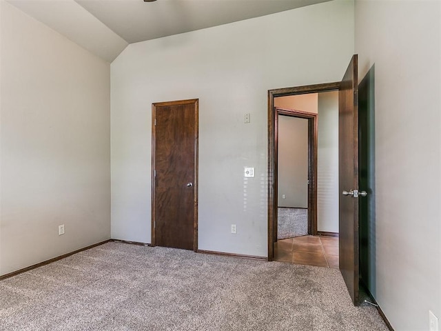 924 Regal Rd, Yukon, OK 73099 - unfurnished bedroom featuring carpet, baseboards, and lofted ceiling