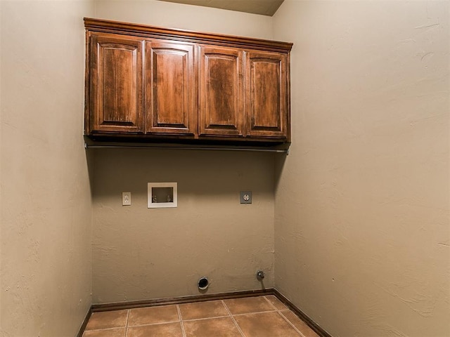 924 Regal Rd, Yukon, OK 73099 - laundry room with cabinet space, washer hookup, hookup for an electric dryer, and baseboards