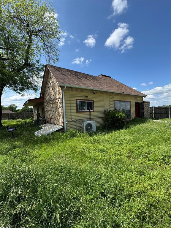 4700 NE 36th St, Oklahoma City, OK 73121 - view of property exterior with fence and a cooling unit