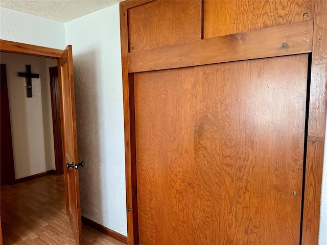 321 E Ninth St, Leedey, OK 73654 - detailed view of wood finished floors and baseboards