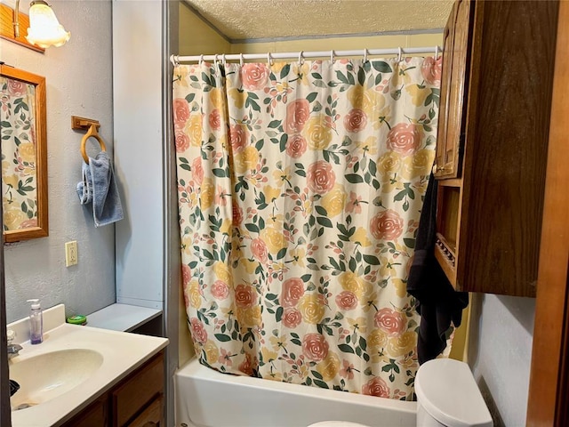321 E Ninth St, Leedey, OK 73654 - bathroom featuring shower / bath combination with curtain, a textured ceiling, vanity, toilet, and a textured wall