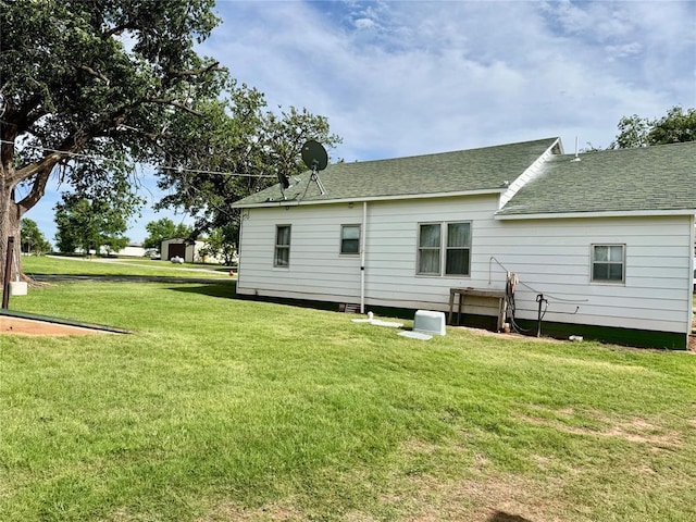321 E Ninth St, Leedey, OK 73654 - back of house featuring a yard and a shingled roof