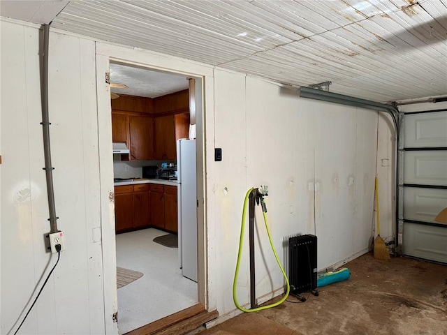 321 E Ninth St, Leedey, OK 73654 - garage with freestanding refrigerator