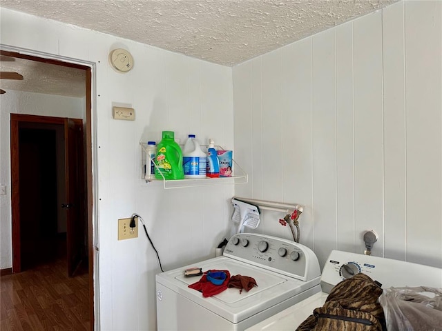 321 E Ninth St, Leedey, OK 73654 - laundry room with washing machine and clothes dryer, wood finished floors, and a textured ceiling