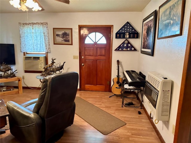 321 E Ninth St, Leedey, OK 73654 - foyer featuring heating unit, light wood-style flooring, ceiling fan, baseboards, and cooling unit