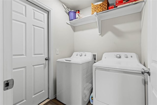 washroom with washing machine and clothes dryer