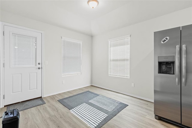 entryway featuring light wood-style floors and baseboards