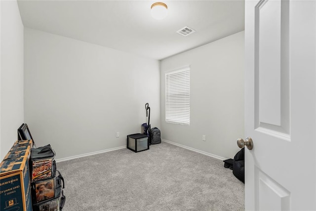 misc room with carpet and baseboards