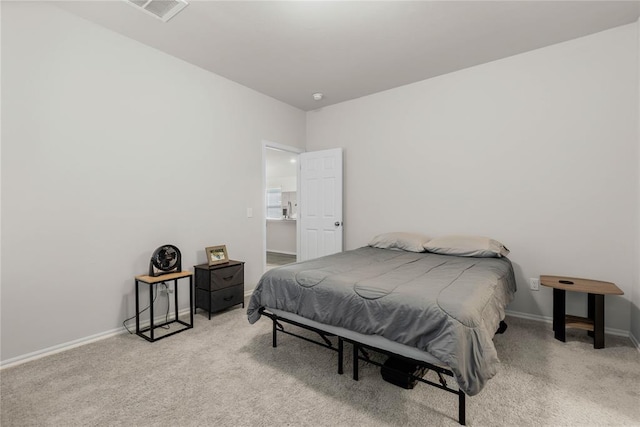 carpeted bedroom with baseboards