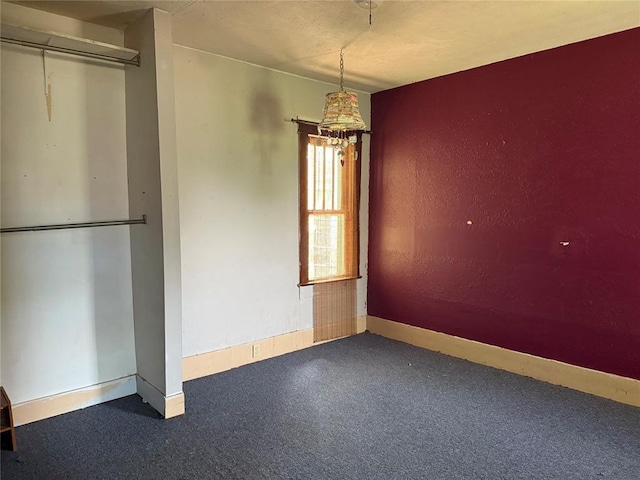 711 E Walnut St, Altus, OK 73521 - unfurnished dining area with baseboards and carpet flooring