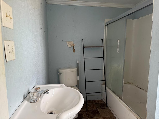 711 E Walnut St, Altus, OK 73521 - bathroom featuring crown molding, shower / bath combination with glass door, a sink, and toilet