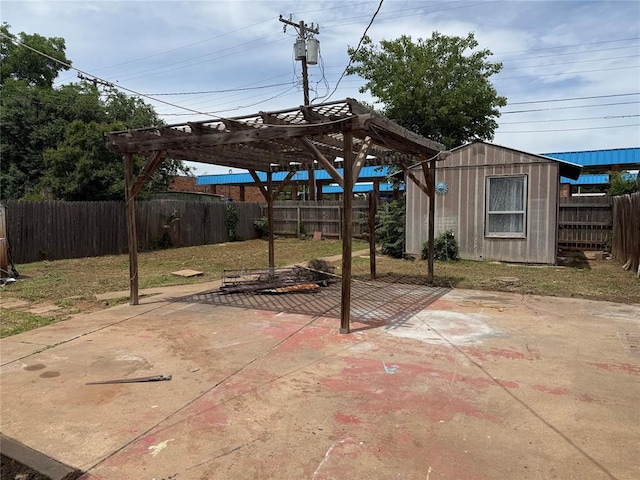 711 E Walnut St, Altus, OK 73521 - view of patio with a fenced backyard, a pergola, a shed, and an outdoor structure