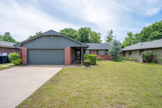 ranch-style home featuring an attached garage, driveway, brick siding, and a front yard