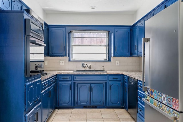 kitchen with stainless steel refrigerator, a sink, black dishwasher, light tile patterned floors, and tasteful backsplash