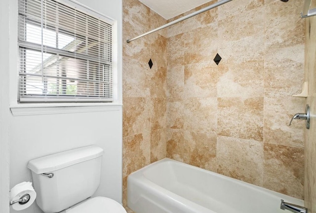bathroom with toilet and tub / shower combination