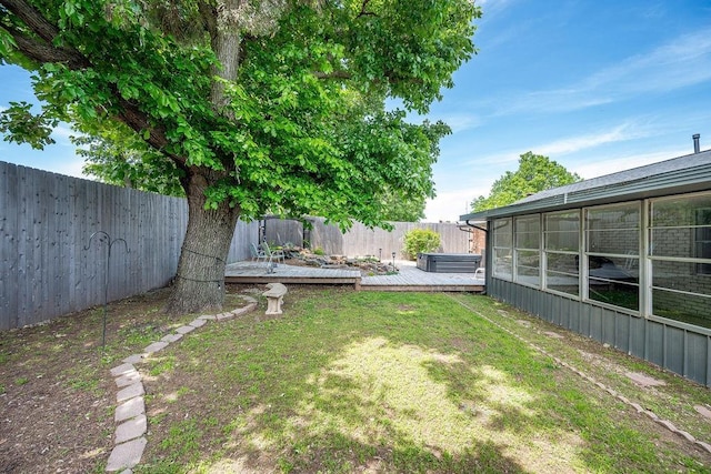 view of yard with a wooden deck