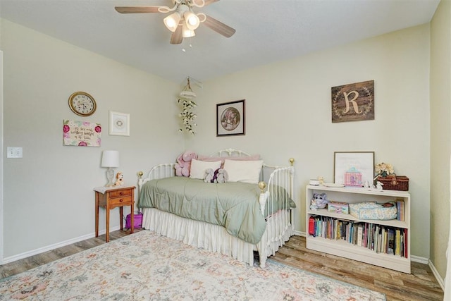 12308 Hickory Creek Blvd, Oklahoma City, OK 73170 - bedroom with wood finished floors, baseboards, and ceiling fan